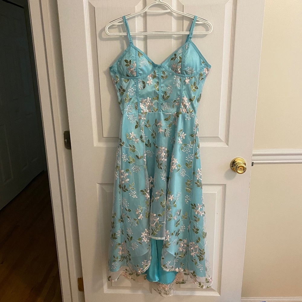 Turquoise Dip Hem Dress with Adjustable Straps and Removable Bra Padding